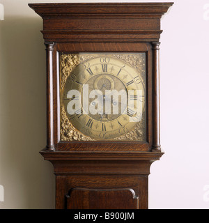 The brass face of the longcase clock in the Parlour at Woolsthorpe Manor. It probably dates from c. 1730 Stock Photo