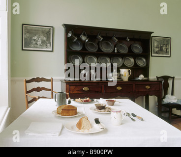 The Common Parlour at Wordsworths House with the table laid with tea and cakes and the dresser behind Stock Photo