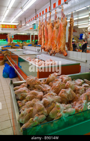 Frozen meats in a butcher s shop in Brixton in London England UK Stock Photo