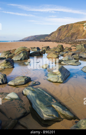 Rocks and rockpools on the beach at Sandymouth Bay North Cornwall England Stock Photo