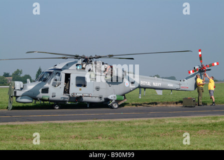 Two technicians work on a Royal navy Lynx helicopter Stock Photo