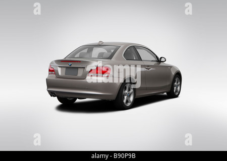 2009 BMW 1-series 128i in Silver - Rear angle view Stock Photo