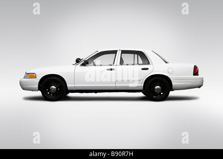 2009 Ford Crown Victoria POLICE INTERCEPTOR in White - Drivers Side Profile Stock Photo