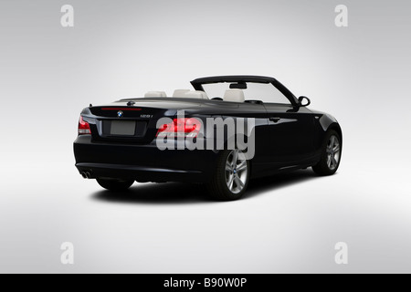 2009 BMW 1-series 128i in Blue - Rear angle view Stock Photo