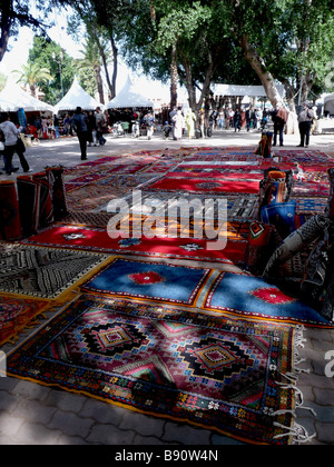 Berber and Arab rugs are displayed in an artisans market in Djma el Fna, the main square of Marrakech, Morocco. Stock Photo