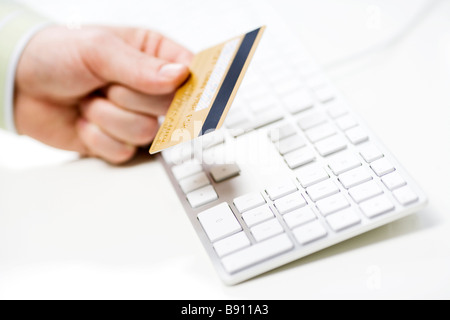 A credit card on a keyboard Sweden. Stock Photo