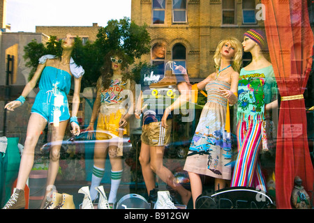 Mannequins and street reflection in a storefront window.  Exchange District, Winnipeg, Manitoba, Canada. Stock Photo