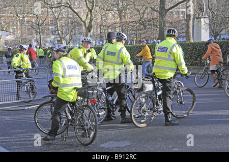 Metropolitan police on bikes at climate change march London England UK