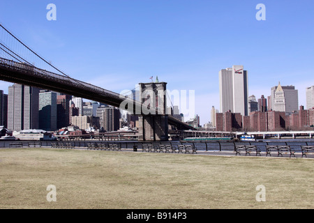The Brooklyn Bridge, looking west across the East River toward lower Manhattan, from Brooklyn waterfront, New York City, USA Stock Photo