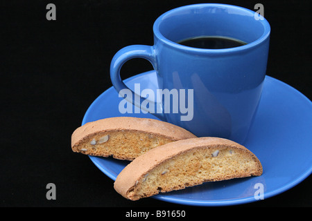 American coffee and biscotti against a white or blue background Stock Photo