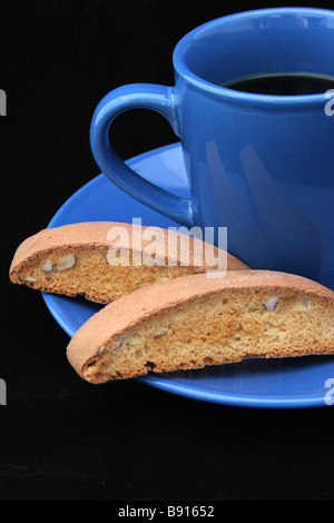 American coffee and biscotti against a white or blue background Stock Photo