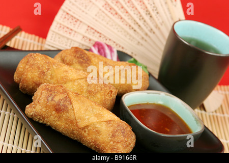 Crispy egg rolls served with tea  Stock Photo