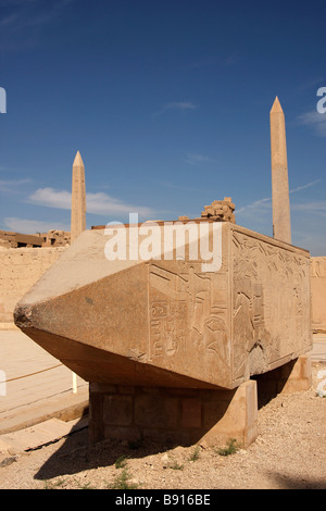 Pyramidion tip of fallen Obelisk of Queen Hatshepsut, two standing obelisks in background, Karnak Temple, Luxor, Egypt Stock Photo