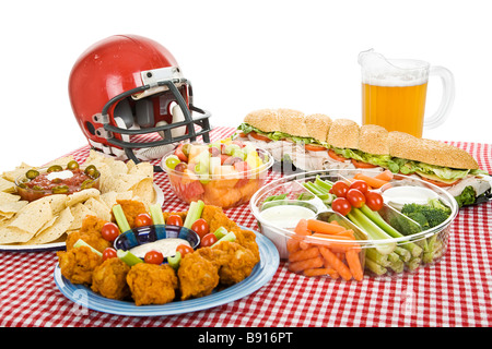 Table set with munchies for a Super Bowl party White background  Stock Photo