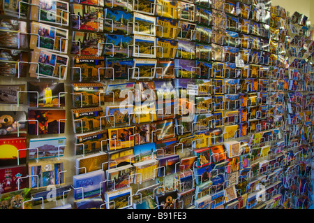Wall display of travel postcards Stock Photo