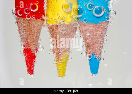 coloured pencil in sparkling water Stock Photo