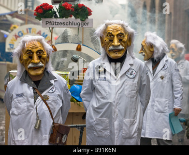 Marchers dressed as Einsteins in the Fasnacht, a winter carnival in the northwestern Swiss city of Basel Stock Photo