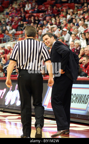 Tony Bennett, head basketball coach at Washington State, discusses a call with one of the referees during a 2008-09 Pac-10 game. Stock Photo