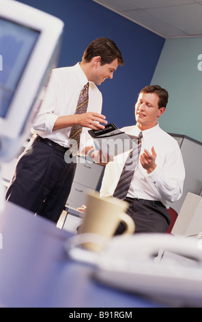 Businessmen having office meeting Stock Photo