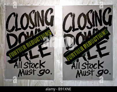 Closing down sale all stock must go further reductions poster in shop window Stock Photo