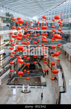 Interior view of atrium of modern upmarket Seasons Place shopping mall in central Beijing Stock Photo