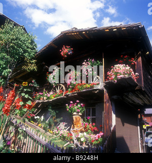Typical wooden building in Murren, a flower filled car free village set on a high mountain plateau Stock Photo