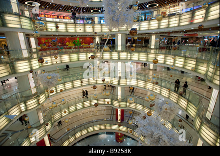 Interior view of spectacular circular atrium inside modern Joy City shopping mall in Xidan district of Beijing Stock Photo