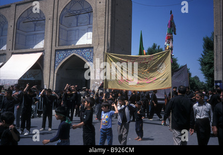 Muharam mourners banners flags entering Meidan e Imam Isfahan Iran Stock Photo