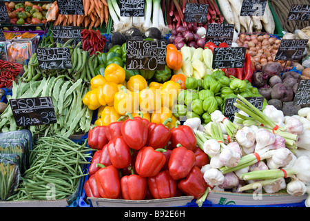 Vegetables displayed on stall at the popular Naschmarkt open air market in Vienna Austria Stock Photo