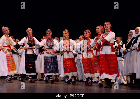 Croatian Folk Dance Group performing on Stage in Traditional Costume Stock Photo