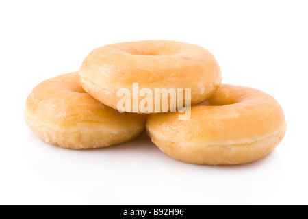 Three doughnuts or donuts piled isolated on white Stock Photo