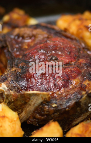 Roast Beef and roast potatoes in roasting tin Stock Photo