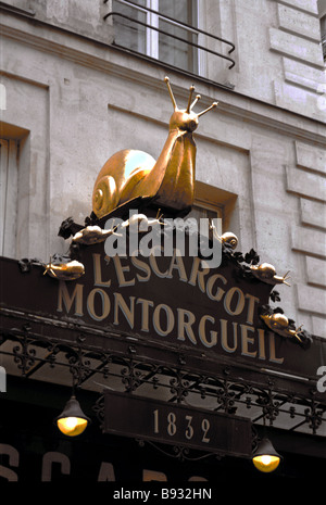 Opened in 1832, the L'Escargot Montorgueil restaurant in Paris sports a large gilded snail sculpture to commemorate the restaurant's signature dish. Stock Photo