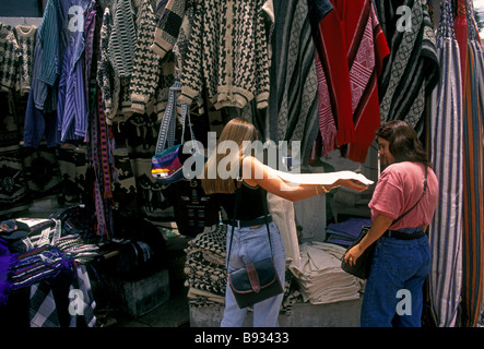 Ecuadoran women, vendor, shopping, Otavalo Market, Indian market, Plaza de Ponchos, town of Otavalo, Imbabura Province, Ecuador, South America Stock Photo