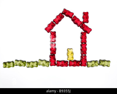 jellybabies formed as a house on white background