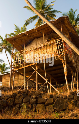 Golden bungalow on the beach cliff at sunstet. Stock Photo