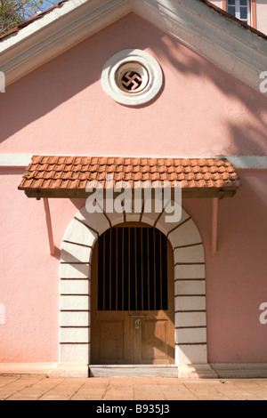 Mangueshi Temple of Goddess Shantadurga near entrance building decorated with swastika  ,Goa,India. Stock Photo