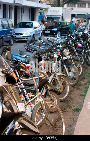 Many bikes parked on street in Panjim, Goa,Inida. Stock Photo