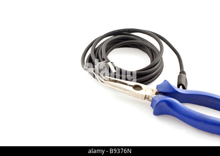 clew of black HDMI cable with a nippers on a white background Stock Photo
