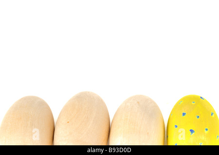 Easter wooden eggs on a white background Stock Photo