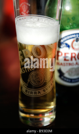 A pint glass of Peroni beer on a bar in a pub Stock Photo - Alamy