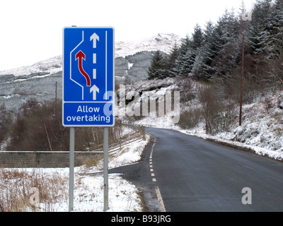 Allow overtaking sign on narrow road Stock Photo