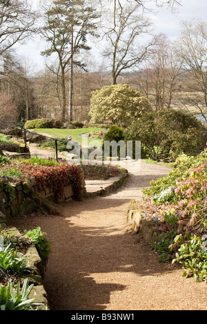 winding footpath through flower beds Stock Photo