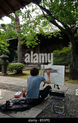 Young japanese painter. Gokoku-ji Temple complex. Bunkyo-ku. Tokyo. Japan Stock Photo