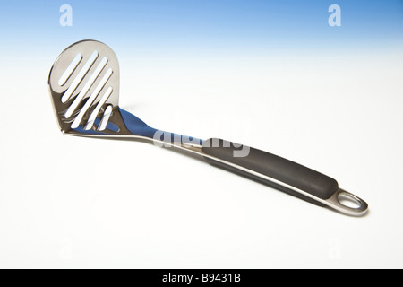 Potato masher Stainless steel utensil  Stock Photo