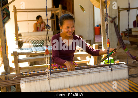 Cambodian women weaving textiles photographed at an island village on the Mekong River Phnom Penh Cambodia Stock Photo