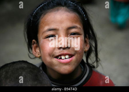 Annapurna Nepal 19 March 2008 Young Nepali girl teasing trekkers for a few biscuits Stock Photo