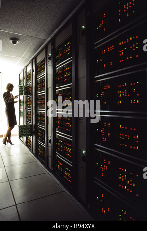 Technicians with servers telecommunication central switching station Stock Photo