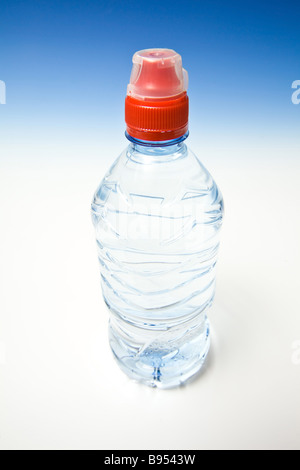 Bottled water on a graduated blue studio background Stock Photo