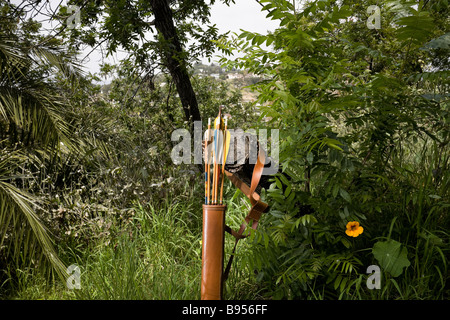 A quiver with arrows against tree in a forest Stock Photo